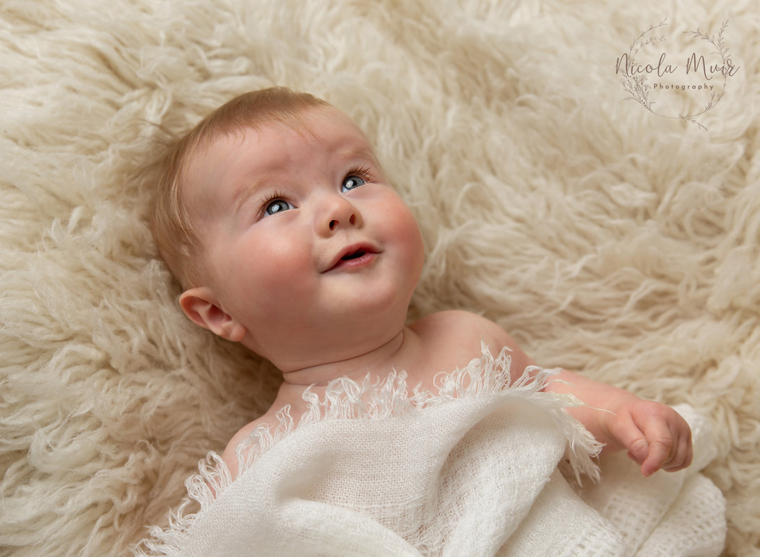 nicola muir photography portrait session baby girl 5 months old looking up pretty eyes