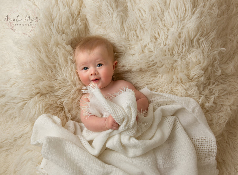 nicola muir photography portrait session baby girl 5 months old wide eyes